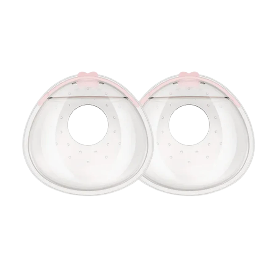 Paire de recueil de lait maternel en silicone transparent avec joint rose. À glisser dans le soutien-gorge pour récupérer le lait durant la journée.