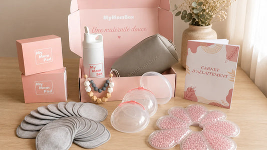 Coffret d’allaitement MyMomBox avec coussinets lavables, recueils-lait, coussinets thermoperles, gourde, trousse et carnet d’allaitement.